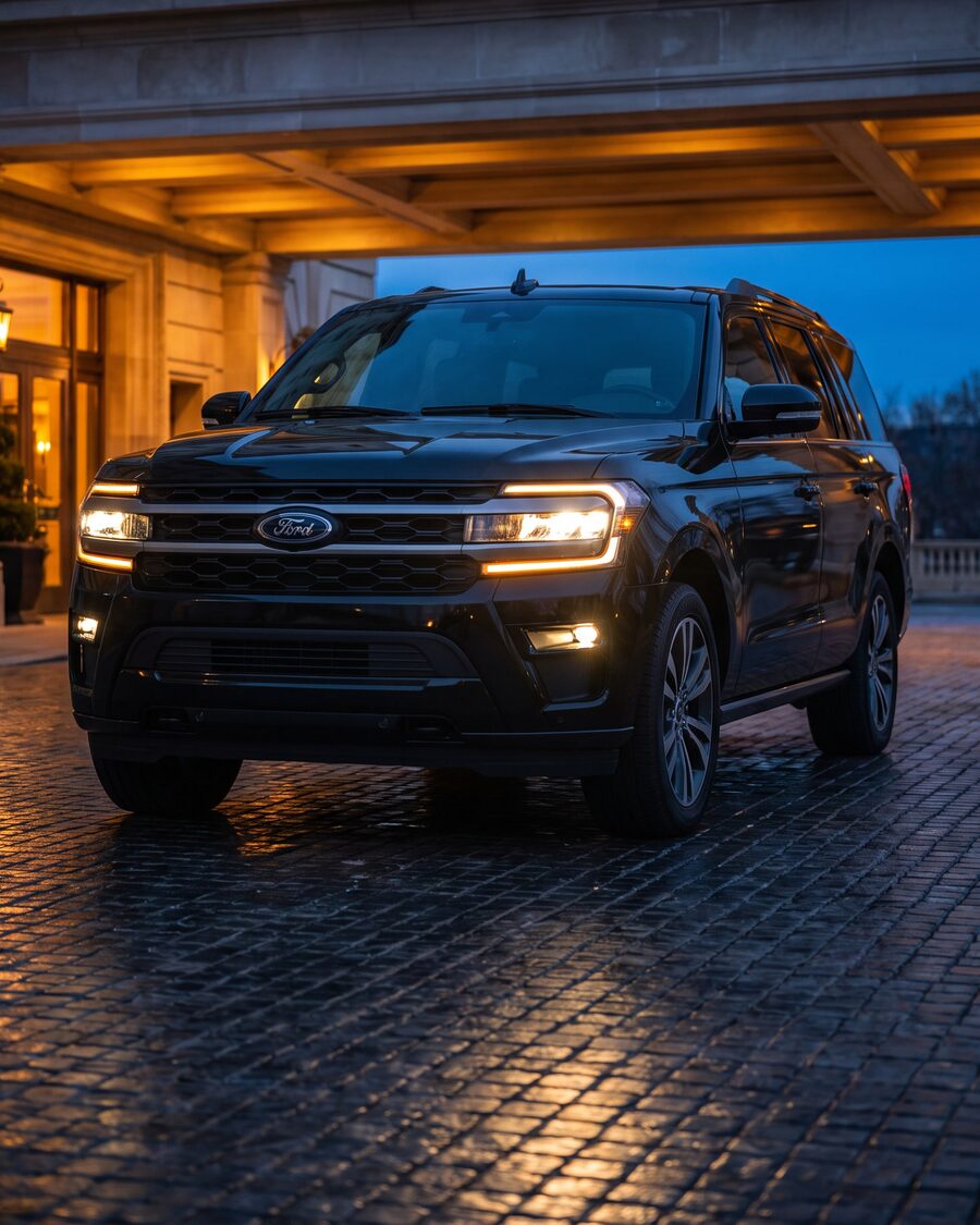 Black 2026 Ford Expedition photographed front three-quarter at a lit hotel entrance