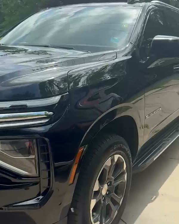 Rear three-quarter view of the black Chevrolet Suburban